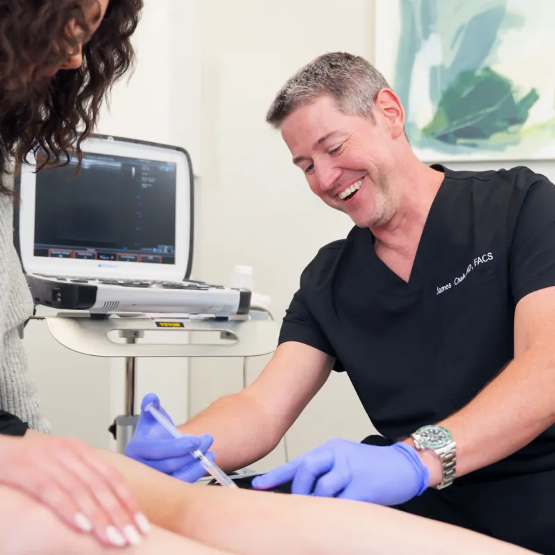 Dr. Shaun Cole performing a leg ultrasound evaluation on a patient at Vein Centers NY in Astoria, New York.