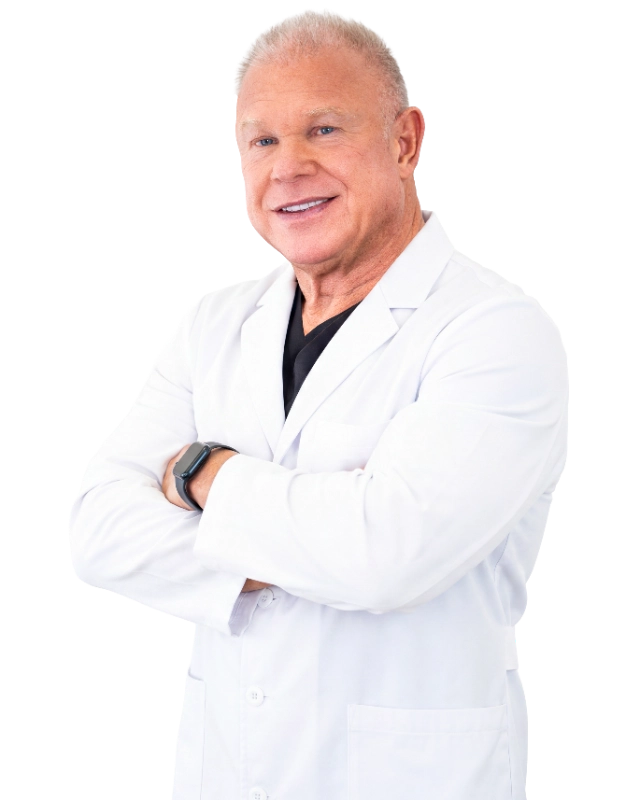Professional headshot of Dr. David Stone, MD, a healthcare provider wearing a white lab coat over a black shirt, smiling at the camera with arms crossed in a confident, professional pose. The image features a black background and is a standard clinical portrait appropriate for medical practice representation.